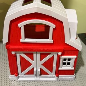 Red and White Toy Barn with Green Toys Logo